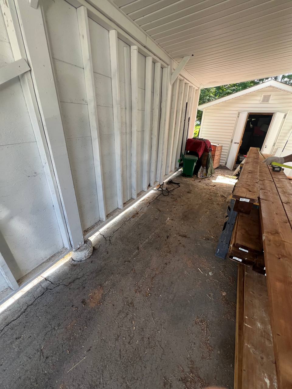 After: the same walkway swept clean with all junk hauled away